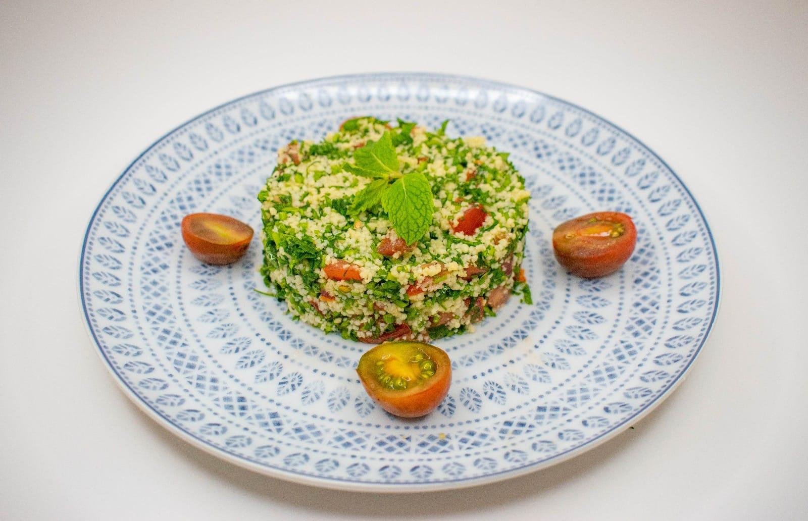 Tabbouleh salad on a blue and white plate